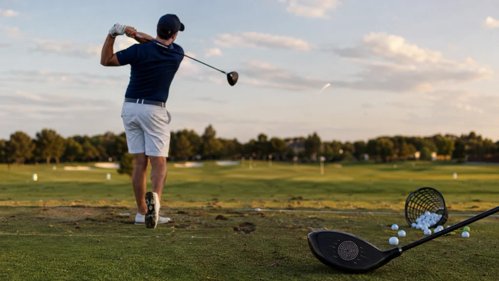 Golfer testing compact backswing distance with a driver, centered strike and balanced full finish
